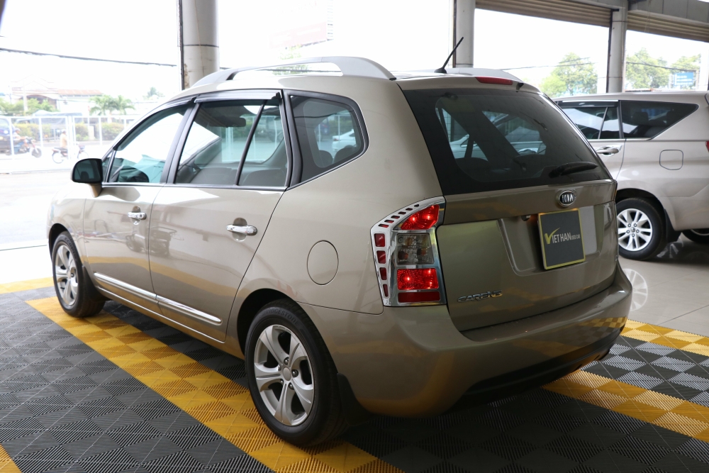 Bán Kia Carens EX 2.0MT màu vàng cát số sàn sản xuất 2015 biển Sài Gòn đi 38000km