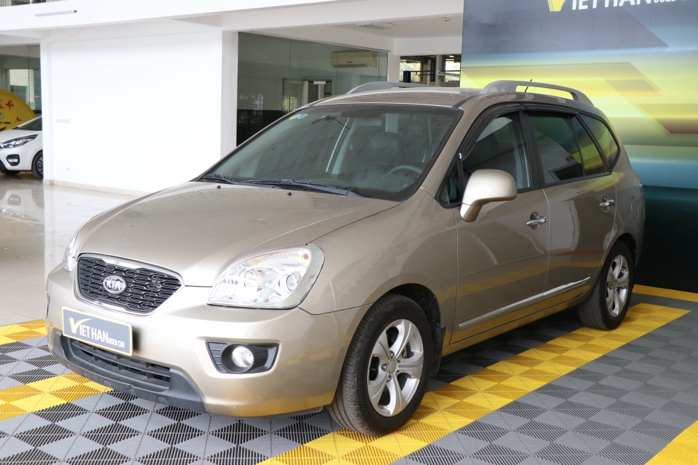 Bán Kia Carens EX 2.0MT màu vàng cát số sàn sản xuất 2015 biển Sài Gòn đi 38000km