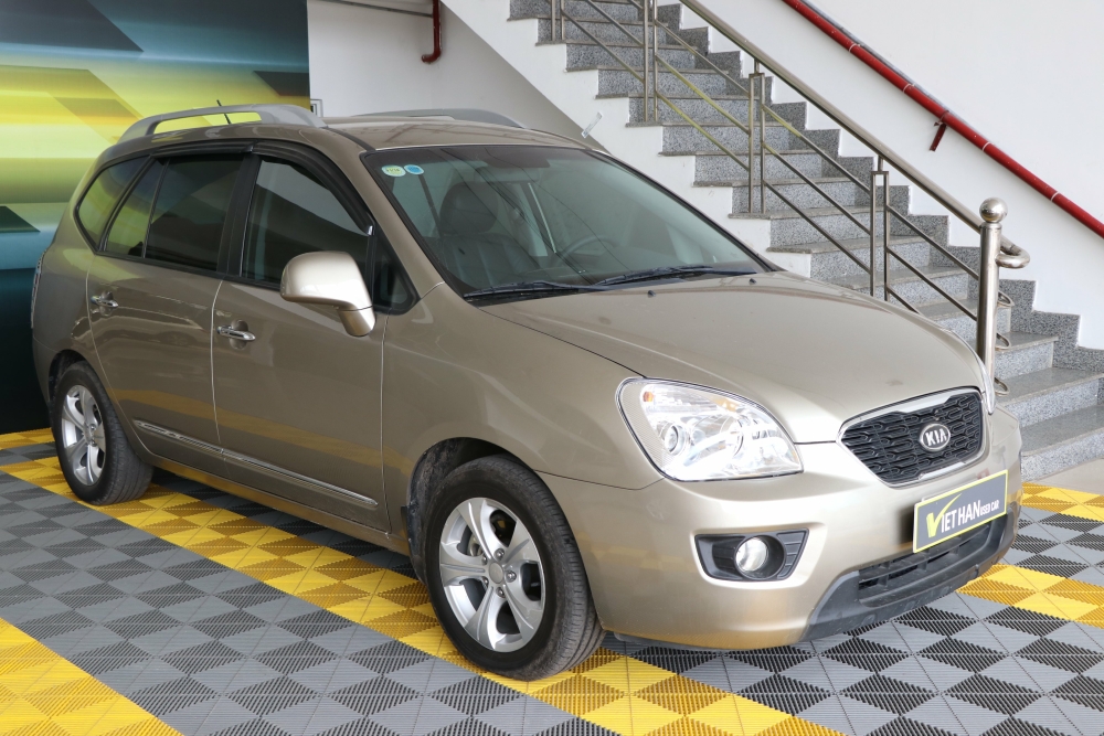Bán Kia Carens EX 2.0MT màu vàng cát số sàn sản xuất 2015 biển Sài Gòn đi 38000km