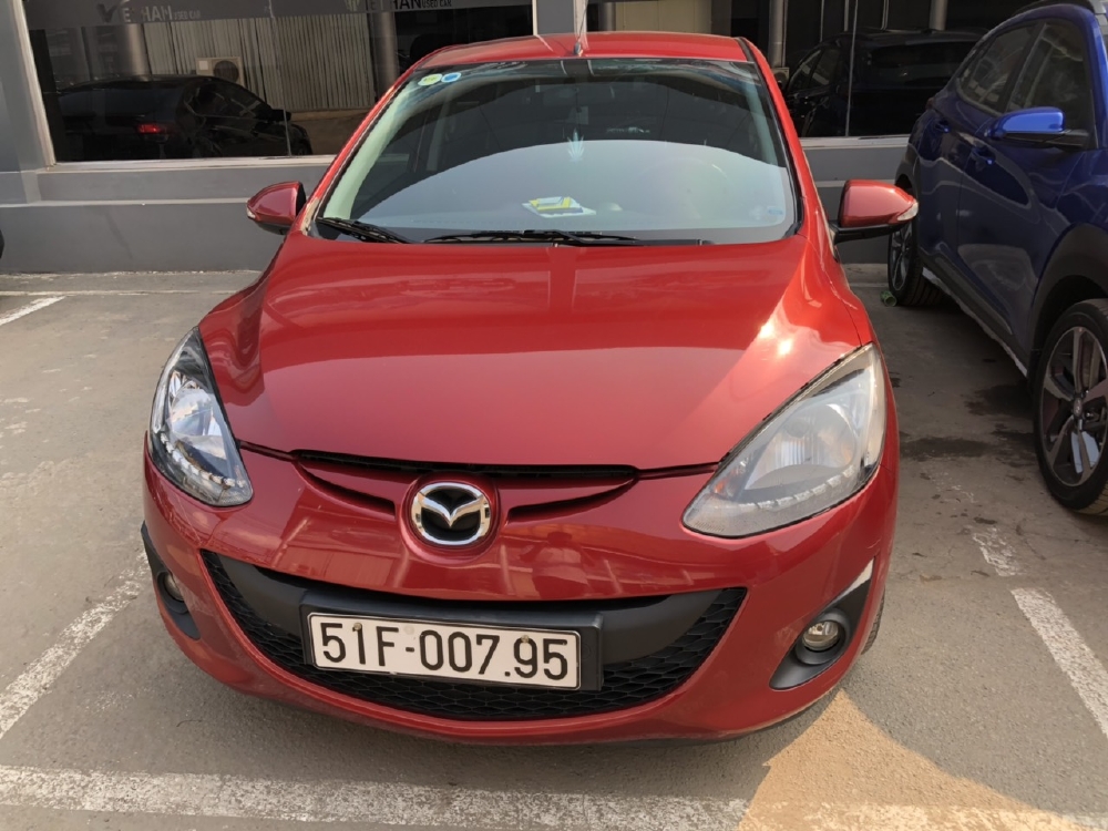 Bán Mazda 2s HB 1.5AT màu đỏ số tự động sản xuất cuối 2014 biển Sài Gòn 1 chủ đi 45000km