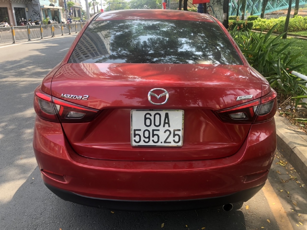 Bán Mazda 2 sedan 1.5AT màu đỏ số tự động sản xuất 2016 biển Đồng Nai đi 42000km