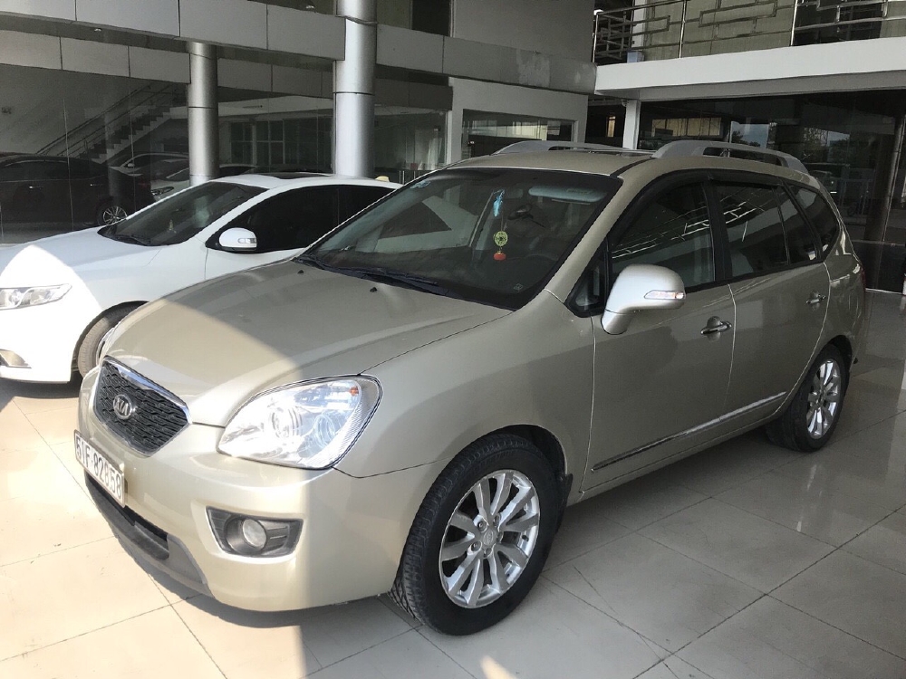 Bán Kia Carens SX 2.0MT màu vàng cát số sàn sản xuất 2012 biển Sài Gòn bản đủ