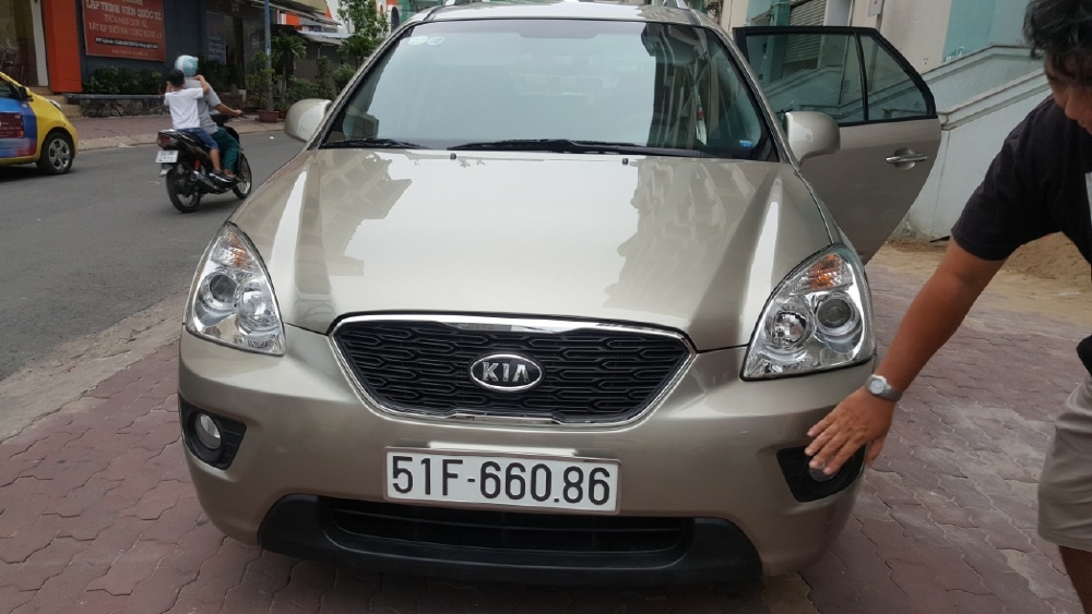 Bán Kia Carens EX 2.0MT màu vàng cát số sàn sản xuất 2016 biển Sài Gòn 1 chủ