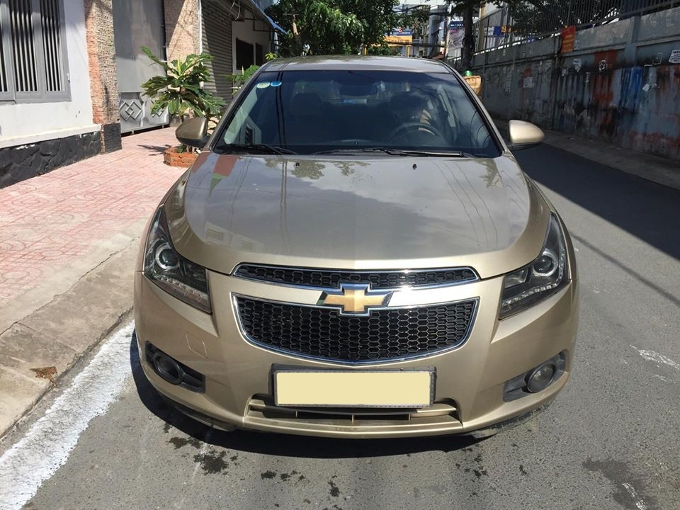 Bán Chevrolet Cruze LS 2011 số sàn màu vàng gia đình chính chủ