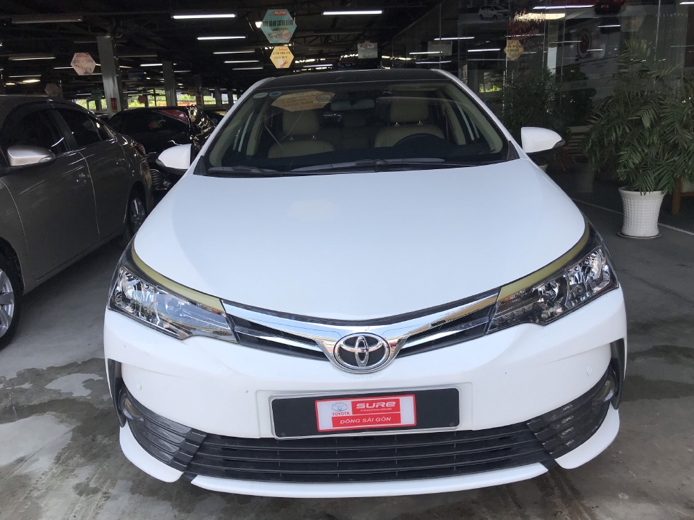 Bán xe Altis 1.8E AT, đời 2018, màu trắng  Odo 12530km , xe đẹp như mới, còn bảo hành chính hãng, có hỗ tợ trả góp