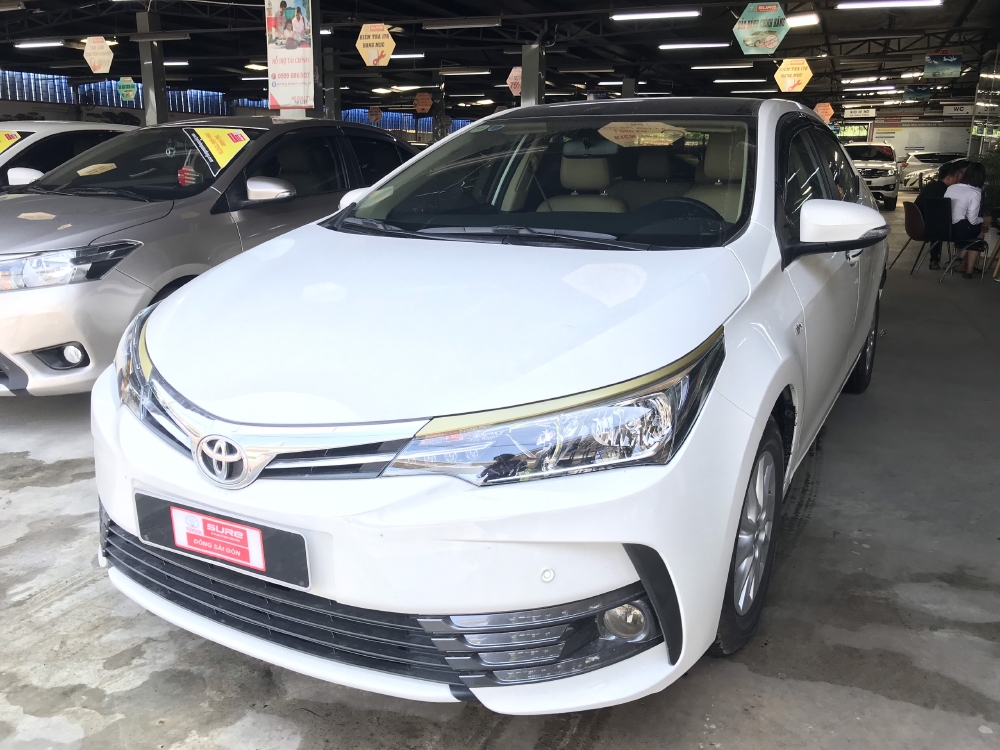 Bán xe Altis 1.8E AT, đời 2018, màu trắng  Odo 12530km , xe đẹp như mới, còn bảo hành chính hãng, có hỗ tợ trả góp
