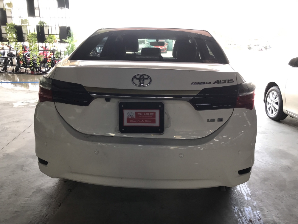 Bán xe Altis 1.8E AT, đời 2018, màu trắng  Odo 12530km , xe đẹp như mới, còn bảo hành chính hãng, có hỗ tợ trả góp