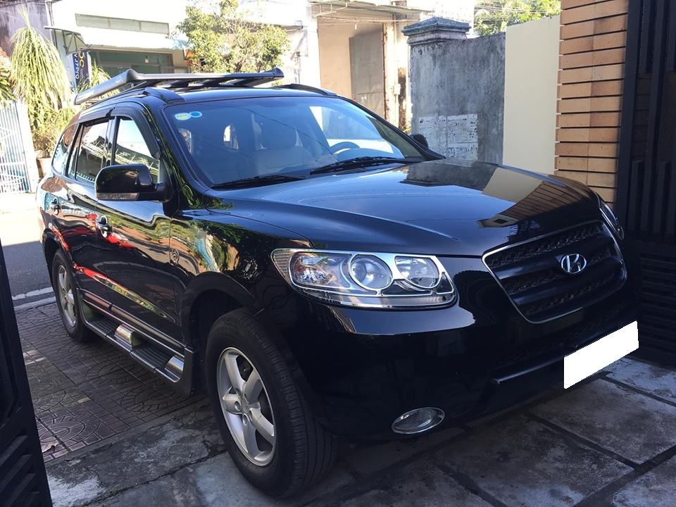 Bán Hyundai Santafe 2009 số sàn màu đen đi đúng 56.000 km rất mới