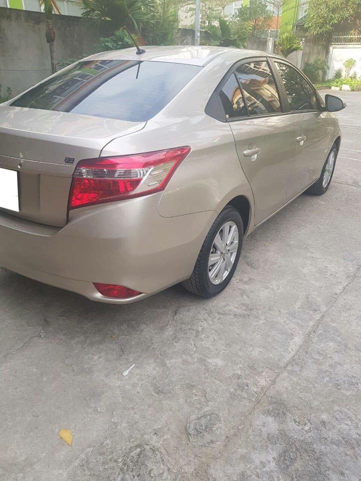 Gia đình cần bán Toyota Vios sx 2016 số tự động màu vàng cát