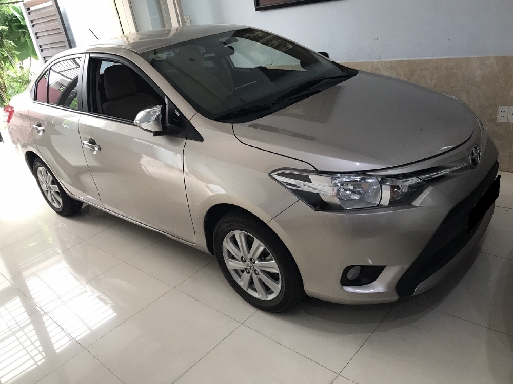 Cần bán xe Toyota Vios 1.5E 2016 số tự động màu vàng cát