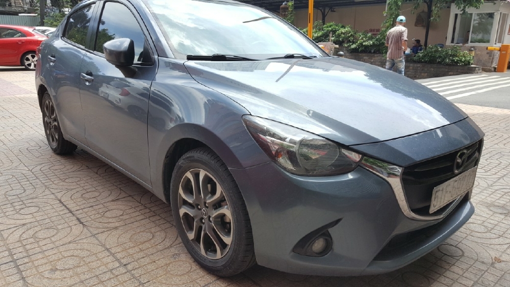 Bán Mazda 2 sedan 1.5AT màu xanh đá số tự động sản xuất 2016 biển Sài Gòn