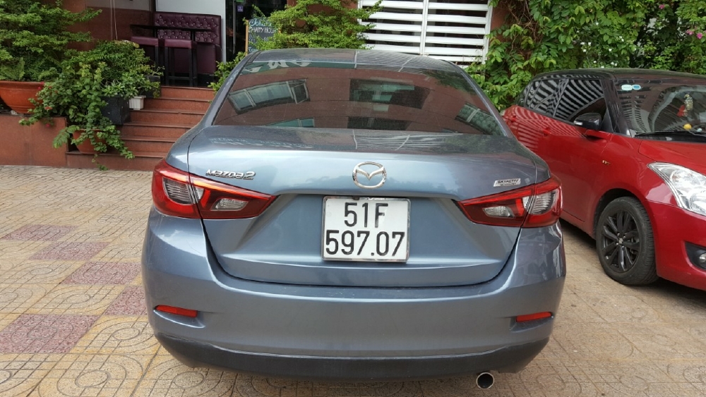 Bán Mazda 2 sedan 1.5AT màu xanh đá số tự động sản xuất 2016 biển Sài Gòn