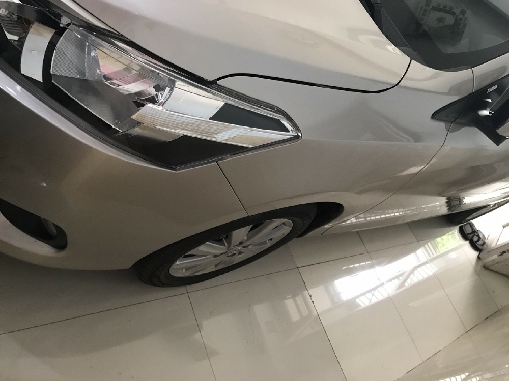 Cần bán xe Toyota Vios 1.5E 2016 số tự động màu vàng cát