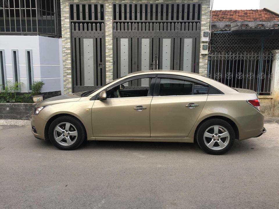 Cruze 2010, số sàn, màu vàng cát
