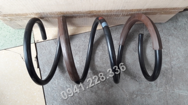 546301D001 Lò xo giảm sóc trước Kia Caren