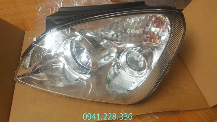 921011D070 921021D070 Đèn pha cos trái Kia Caren