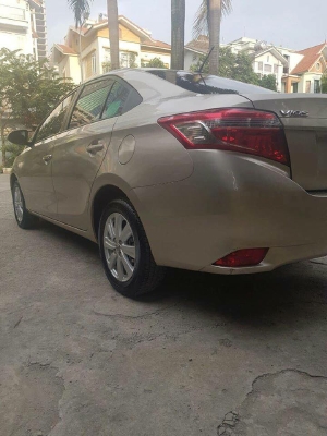 Gia đình cần bán Toyota Vios sx 2016 số tự động màu vàng cát