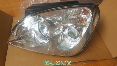 921011D070 921021D070 Đèn pha cos trái Kia Caren